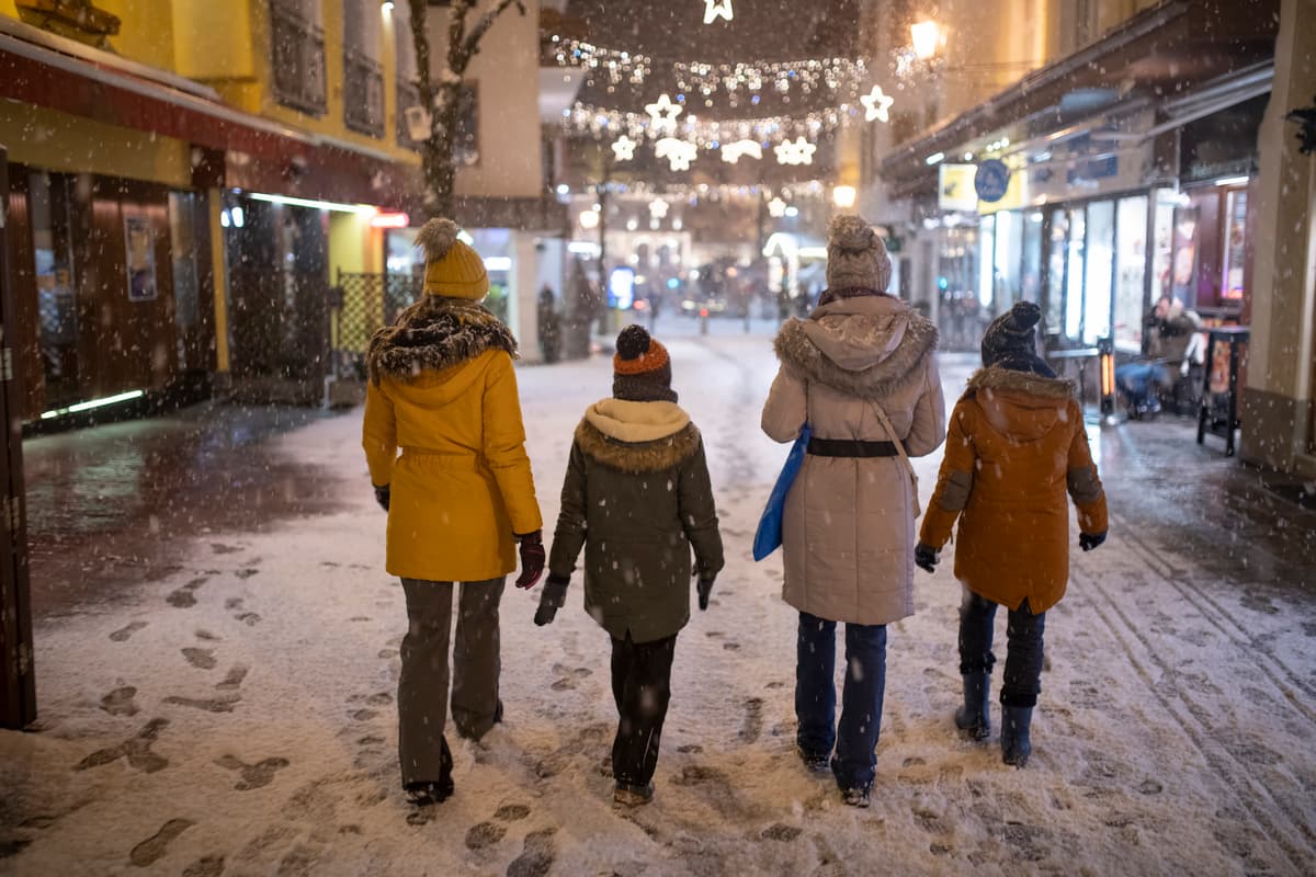 Family shopping at christmas market in Zell am see ski resort