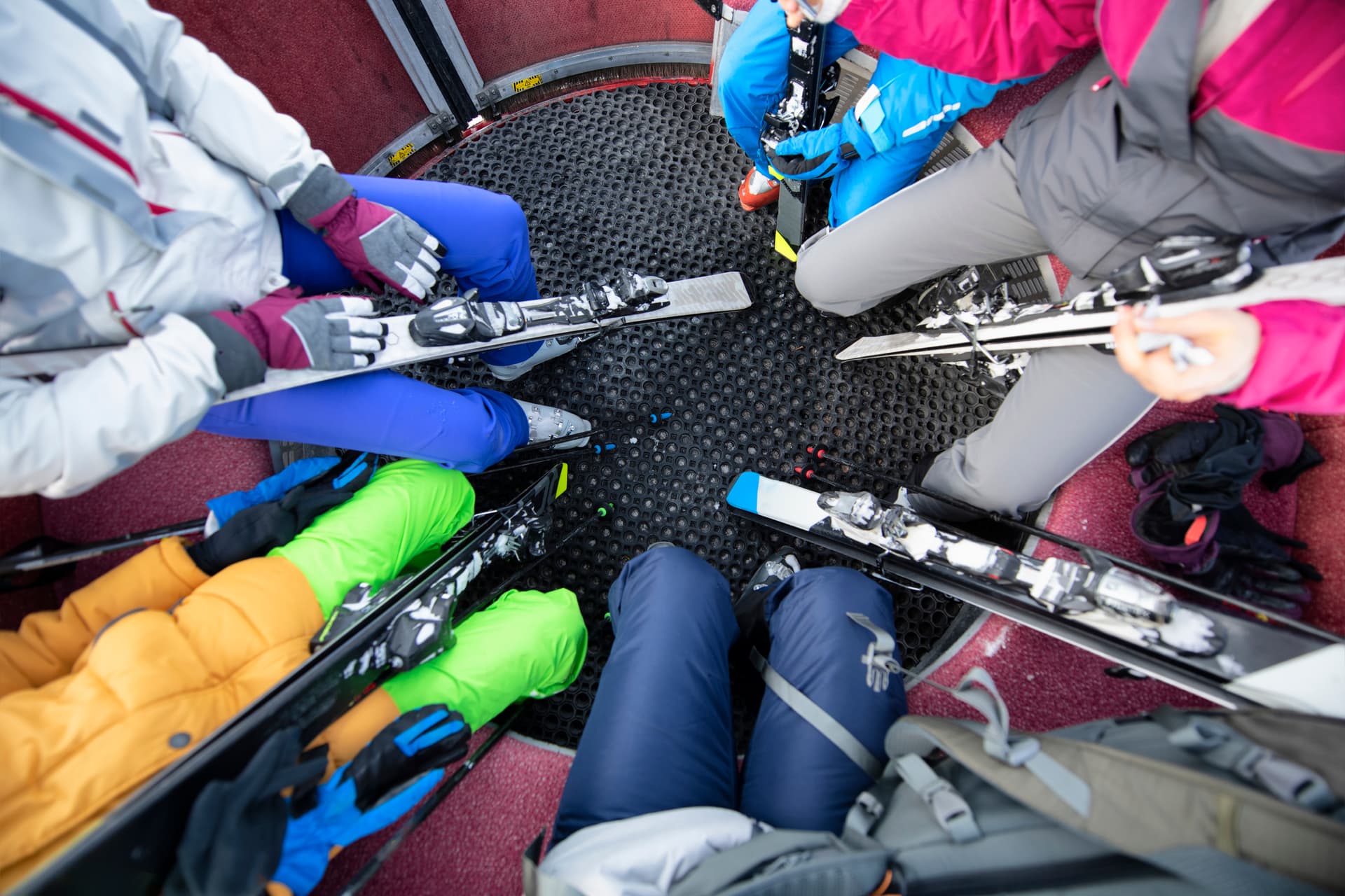 family of skiers in gondola