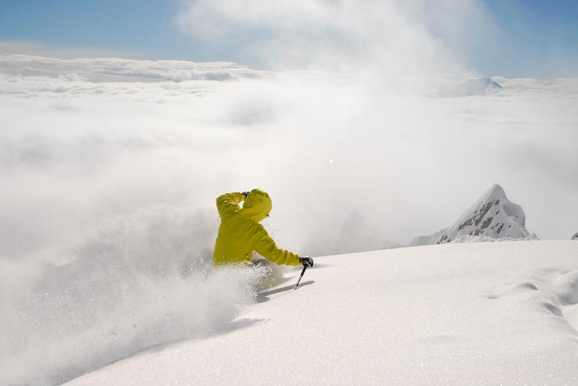 skier carving down off piste slope