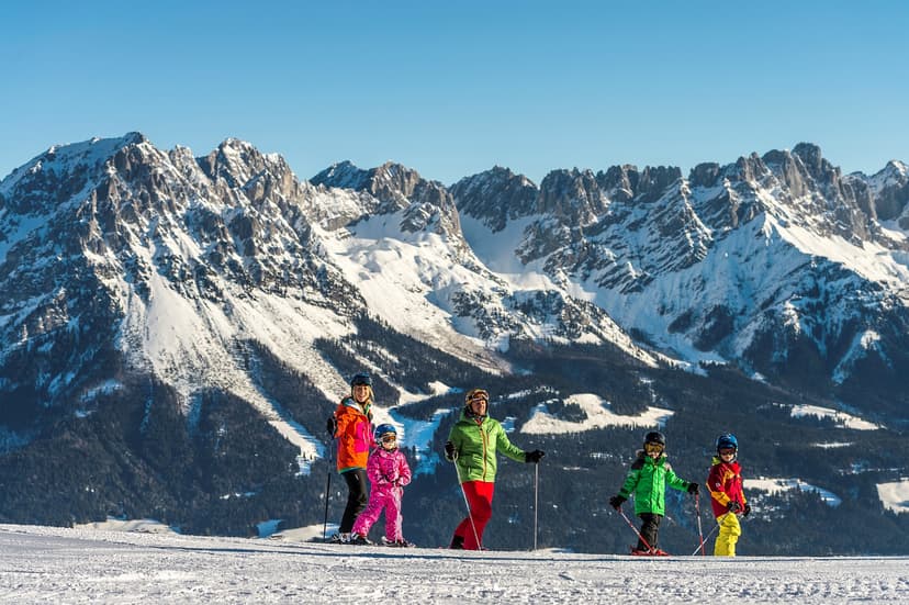 Family of skiers taking break from skiing at Ellmau ski resort