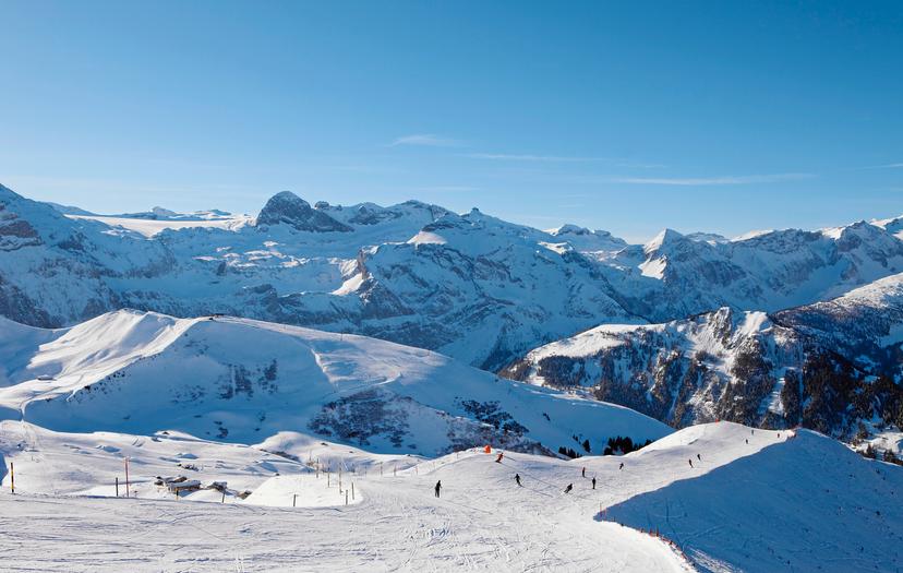 Skiers enjoying slopes of lenk ski resort