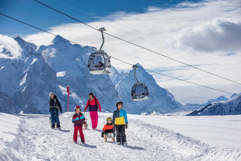 Family sledding at ski resort