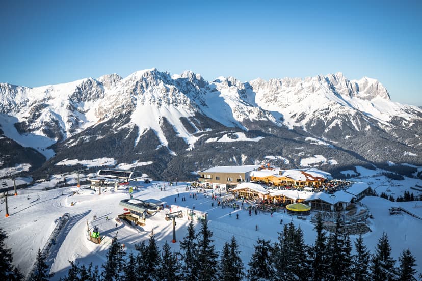 View of a mountain restaurant surrounded by ski lifts